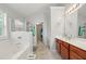 Luxurious bathroom featuring a soaking tub, separate shower, and double vanity at 1871 Stoney Chase Dr, Lawrenceville, GA 30044