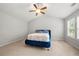 Cozy bedroom with vaulted ceiling, ceiling fan and carpeted floor at 1871 Stoney Chase Dr, Lawrenceville, GA 30044