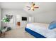 This bedroom offers vaulted ceilings, carpet, a fan, and plenty of natural light at 1871 Stoney Chase Dr, Lawrenceville, GA 30044