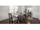 Dining room with glass table and view into the office space with lots of natural light at 1871 Stoney Chase Dr, Lawrenceville, GA 30044