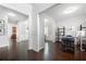 Bright hallway showcasing hardwood floors, white wainscoting, and open doorways to other rooms at 1871 Stoney Chase Dr, Lawrenceville, GA 30044