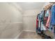 Spacious walk-in closet with ample shelving and storage space at 1871 Stoney Chase Dr, Lawrenceville, GA 30044