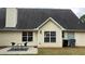 A well-maintained backyard with a patio, seating, and lush lawn at 3066 Gem Creek Rd, Buford, GA 30519