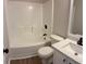 Bathroom featuring a combined tub and shower, and modern vanity with black hardware at 3066 Gem Creek Rd, Buford, GA 30519