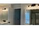 Bathroom featuring a modern vanity and a tub and shower combo with black hardware at 3066 Gem Creek Rd, Buford, GA 30519
