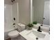Clean bathroom features a tub-shower combo, granite-look vanity, and modern black fixtures at 3066 Gem Creek Rd, Buford, GA 30519