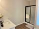 Bathroom featuring a modern vanity and a walk-in shower with sleek black hardware at 3066 Gem Creek Rd, Buford, GA 30519