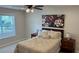 Relaxing bedroom features neutral tones, soft lighting, and a window with natural light at 3066 Gem Creek Rd, Buford, GA 30519