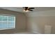 Spacious bedroom with natural lighting and a ceiling fan at 3066 Gem Creek Rd, Buford, GA 30519