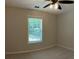 Bedroom with a neutral color scheme, large window, and wall-to-wall carpeting at 3066 Gem Creek Rd, Buford, GA 30519