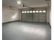 A spacious two-car garage with a neutral paint and sealed concrete floor at 3066 Gem Creek Rd, Buford, GA 30519