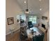 Open concept living room with a fireplace, ceiling fan, and an adjacent dining area at 3066 Gem Creek Rd, Buford, GA 30519