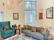 Cozy living room featuring high ceilings, stylish furniture, and an open floor plan at 3066 Gem Creek Rd, Buford, GA 30519