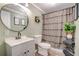 Charming bathroom featuring sleek vanity, round mirror, and patterned shower curtain at 40 Legend Creek Chase, Douglasville, GA 30134