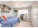 Bedroom setup as office with striped accent wall, window, and built-in shelving at 40 Legend Creek Chase, Douglasville, GA 30134