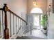Inviting entryway features decorative tile flooring, arched doorway and wrought iron staircase at 40 Legend Creek Chase, Douglasville, GA 30134