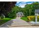 Beautiful two-story home featuring a long driveway with mature trees and landscaping in a lush setting at 40 Legend Creek Chase, Douglasville, GA 30134