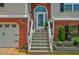 A well-maintained front entrance with steps leading to the front door and manicured landscaping at 40 Legend Creek Chase, Douglasville, GA 30134