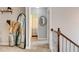 Hallway with access to a bathroom, stairs, and a large standing mirror at 40 Legend Creek Chase, Douglasville, GA 30134