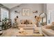 Inviting living room features neutral decor, plenty of seating, and an abundance of natural light at 40 Legend Creek Chase, Douglasville, GA 30134