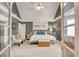 Beautiful main bedroom with vaulted ceilings, accent wall, ceiling fan, and calming color palette at 40 Legend Creek Chase, Douglasville, GA 30134