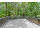 This is a covered wooden back deck overlooking a private backyard at 2189 Spear Point Dr, Marietta, GA 30062