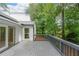 This is a covered wooden back deck overlooking a private backyard at 2189 Spear Point Dr, Marietta, GA 30062