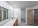 Modern bathroom with dual sinks, a large mirror, and sleek wood vanity at 2189 Spear Point Dr, Marietta, GA 30062