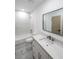 This is a bathroom with marble tile walls, modern vanity, shower and tub combo at 2189 Spear Point Dr, Marietta, GA 30062