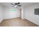 This is a bedroom featuring hardwood floors, white walls, and a ceiling fan at 2189 Spear Point Dr, Marietta, GA 30062