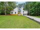Renovated two story home with white paint, side entry garage and gorgeous front yard at 2189 Spear Point Dr, Marietta, GA 30062