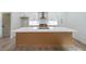 Island kitchen features marble counters, stainless appliances and an open design to the living area at 2189 Spear Point Dr, Marietta, GA 30062