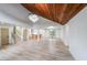 Open-concept space boasts hardwood floors, designer lighting, and easy access to the kitchen at 2189 Spear Point Dr, Marietta, GA 30062