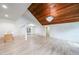 Bright living room with hardwood floors, modern lighting, and stylish wood ceiling feature at 2189 Spear Point Dr, Marietta, GA 30062