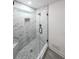 Modern bathroom walk-in shower, marble tile, and elegant fixtures at 2189 Spear Point Dr, Marietta, GA 30062