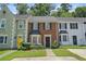 Charming brick townhome featuring well-maintained landscaping and a welcoming front entrance at 2941 Governors Ct, Marietta, GA 30066