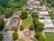 Aerial view of a town square featuring a central fountain, surrounded by trees, buildings, and walkways, a scenic community hub at 3620 W Lawrenceville St, Duluth, GA 30096