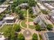 An aerial view of a public square featuring a fountain, green spaces, and surrounding buildings, perfect for recreation at 3620 W Lawrenceville St, Duluth, GA 30096