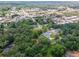 An aerial view showcases a residential neighborhood nestled among lush greenery, offering a serene and private setting at 3620 W Lawrenceville St, Duluth, GA 30096
