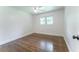Simple bedroom with white trim and window view at 3620 W Lawrenceville St, Duluth, GA 30096