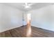 Bright bedroom with view of bathroom, ceiling fan and hardwood flooring at 3620 W Lawrenceville St, Duluth, GA 30096