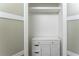 Walk-in closet with built-in shelving and storage drawers, providing ample space at 3620 W Lawrenceville St, Duluth, GA 30096