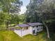 Aerial view of the home featuring a lush backyard at 3620 W Lawrenceville St, Duluth, GA 30096