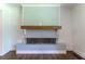 Modern fireplace with a light blue backdrop, hardwood flooring and a wooden beam at 3620 W Lawrenceville St, Duluth, GA 30096
