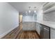 Stylish kitchen with quartz countertops, stainless steel appliances, and open shelving at 3620 W Lawrenceville St, Duluth, GA 30096