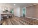 Stylish kitchen with island, stainless steel appliances, and hardwood floors at 3620 W Lawrenceville St, Duluth, GA 30096