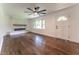 Inviting living room with hardwood floors, fireplace, natural light, and modern ceiling fan at 3620 W Lawrenceville St, Duluth, GA 30096