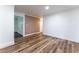 Spacious living room with wood-look floors and modern wall accent at 3620 W Lawrenceville St, Duluth, GA 30096