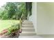 Steps leading up to the home's entrance, surrounded by attractive landscaping at 3620 W Lawrenceville St, Duluth, GA 30096