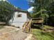 Exterior of home showing back deck and yard surrounded by mature trees at 4610 Wilson James Sw Rd, Atlanta, GA 30331